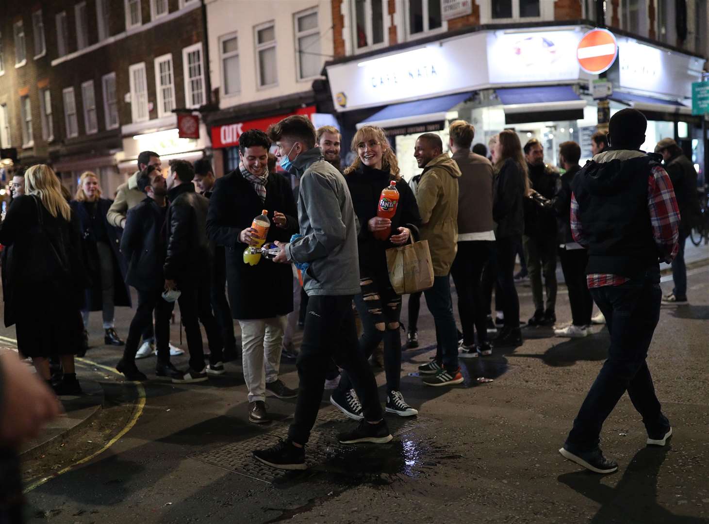 People in Soho, London, after pubs and restaurants were subject to a 10pm curfew to combat the rise in coronavirus cases in England (Yui Mok/PA)