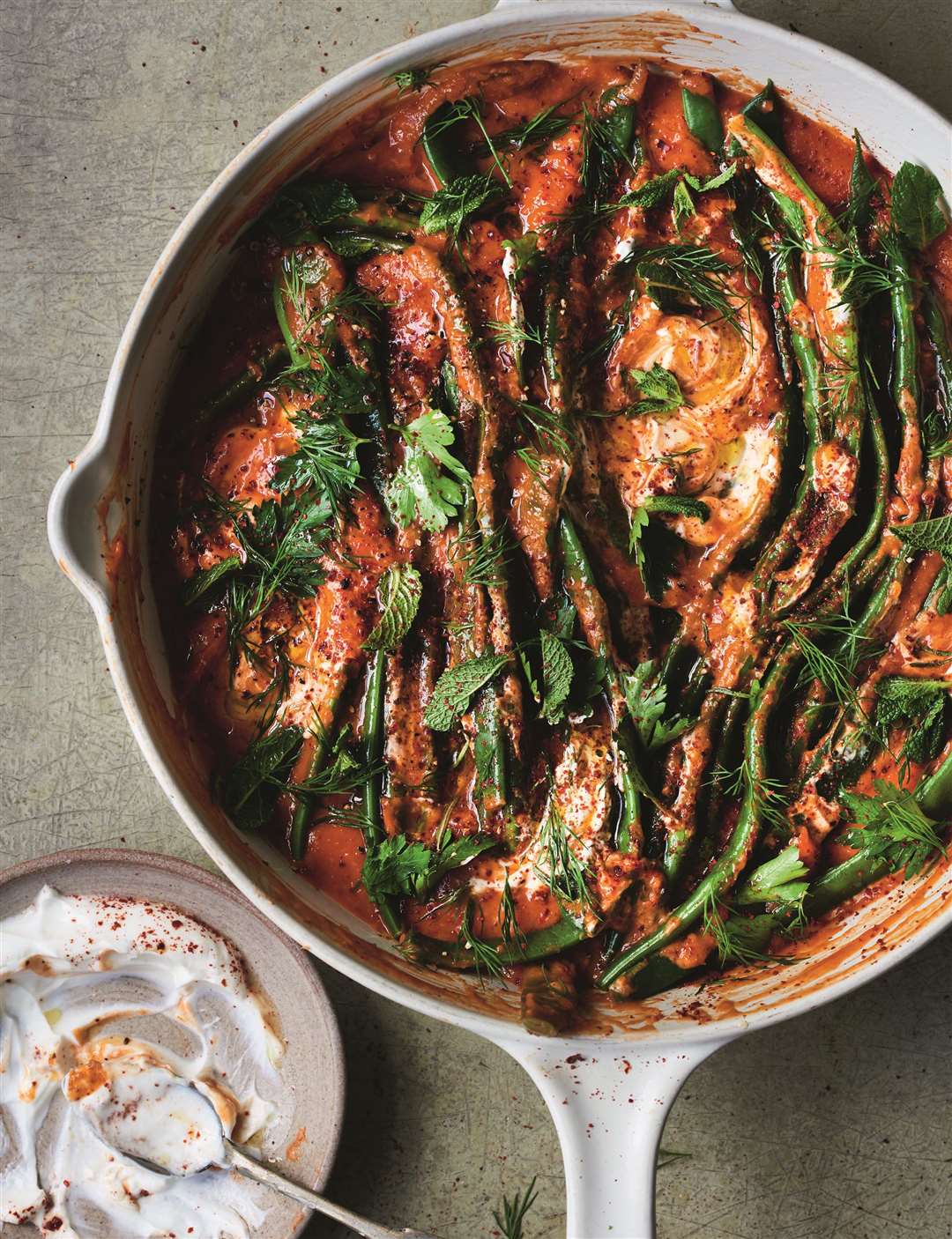 Braised flat beans in slow cooked tomato sauce from Restore by Gizzi Erskine. Picture: HQ/Issy Croker/PA