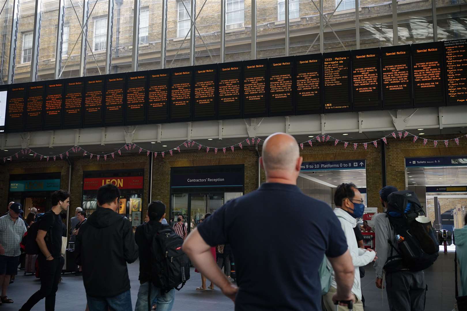 Departure boards at King’s Cross station in London (Yui Mok/PA)