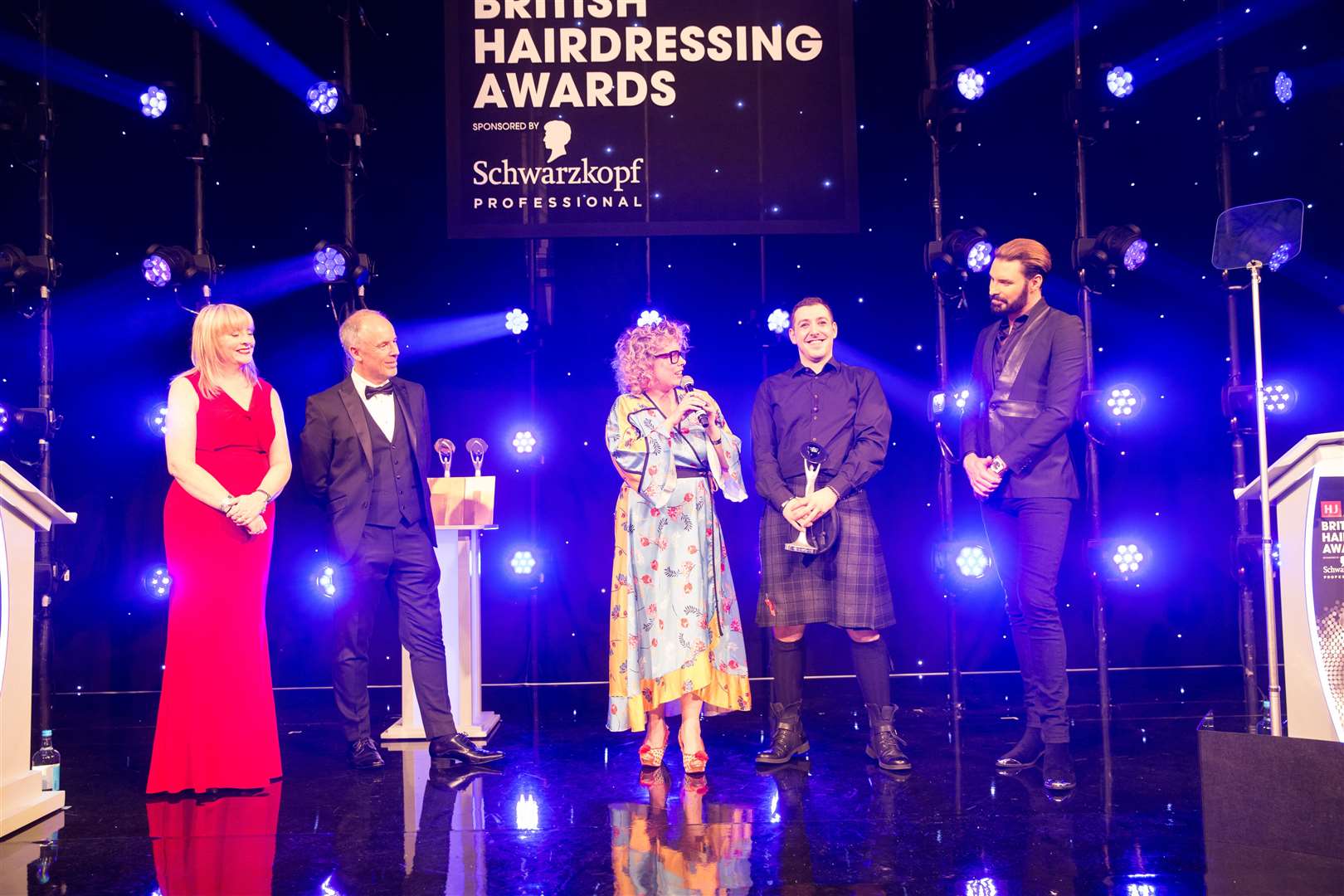 Representatives of Ego Hair Design alongside Rylan Clark won one of the company's three British Hairdressing Awards.