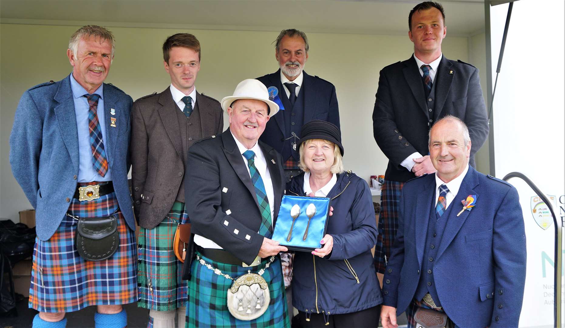 Compere at the event Willie Mackay was delighted to receive an engraved set of silver spoons. Picture: DGS