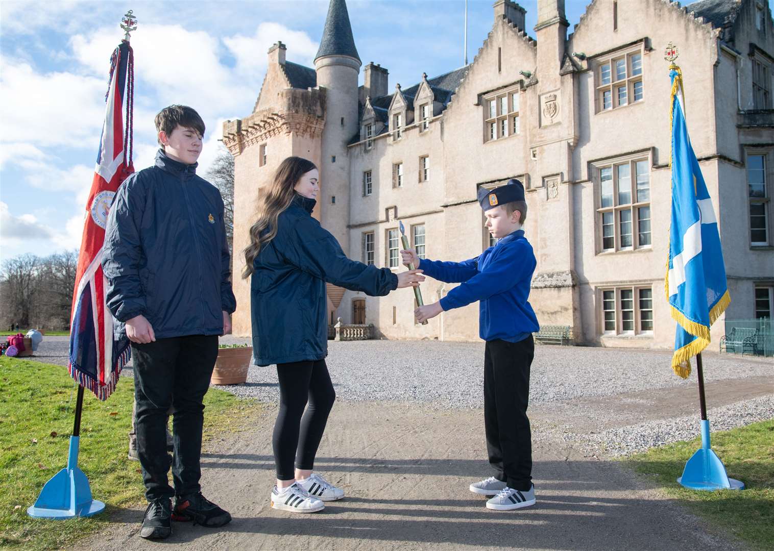 Jack Coulby (right) hands the baton over to Kayleigh MacColl...The 2nd Forres Boys' Brigade hand over the Boys' Brigade Baton to Nairn at Brodie Castle. ..Picture: Daniel Forsyth..
