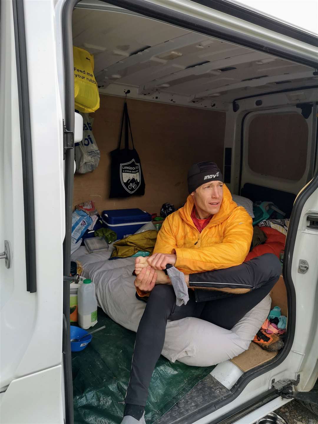 Looking after his feet in the van during a support stop.