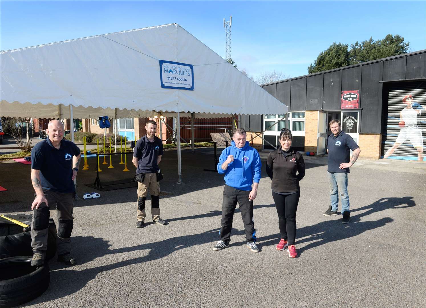 Thanks to a donation from neigbouring business North of Scotland Marquees the Jacobite Boxing Club in Nairn will run outdoor sessions..David Douglas(left),Stephen Main and Richard Miller of North of Scotland Marquees with Bobby Russell and Fiona Morrison(centre)of the club..Picture: Gary Anthony..