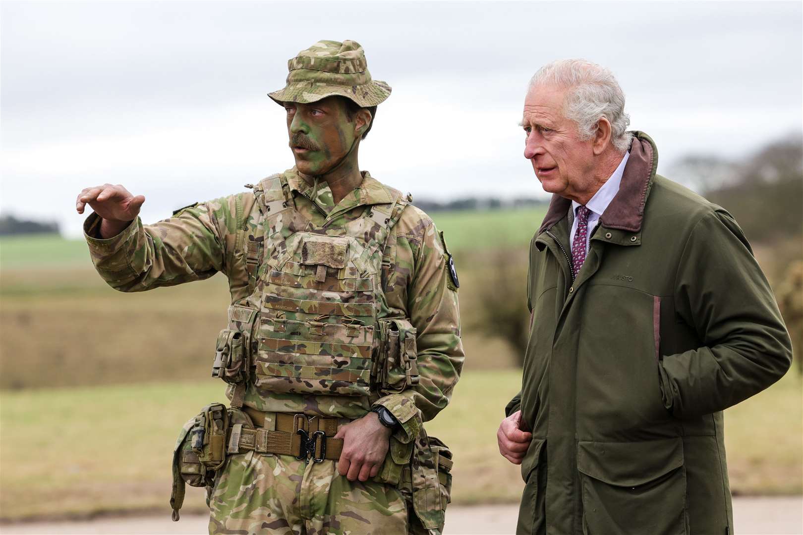 The King meets Major Tony Harris ahead of a trench attack and defence simulation during a visit to a training site for Ukrainian military recruits in Wiltshire (Chris Jackson/PA)