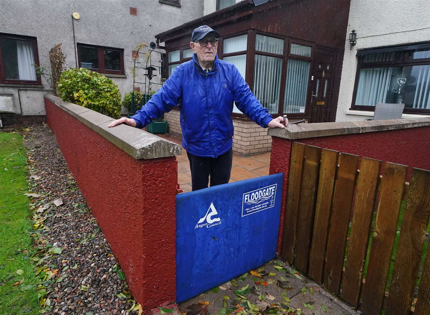 John Stewart with his flood defence outside his home on River Street, Brechin (Andrew Milligan/PA)