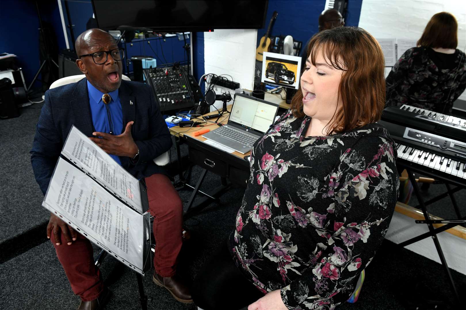 Tony Henry giving Lisa Gray a singing lesson in his studio in Canal Road.