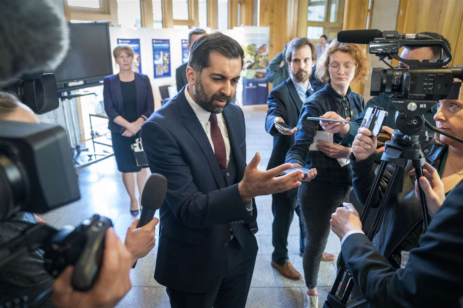 First Minister Humza Yousaf speaks to the media after delivering a statement on ‘Our Priorities for Scotland’, in the main chamber of the Scottish Parliament (Jane Barlow/PA)