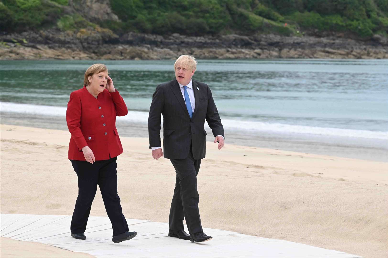 Prime Minister Boris Johnson speaks to German Chancellor Angela Merkel at the G7 summit (Leon Neal/PA)