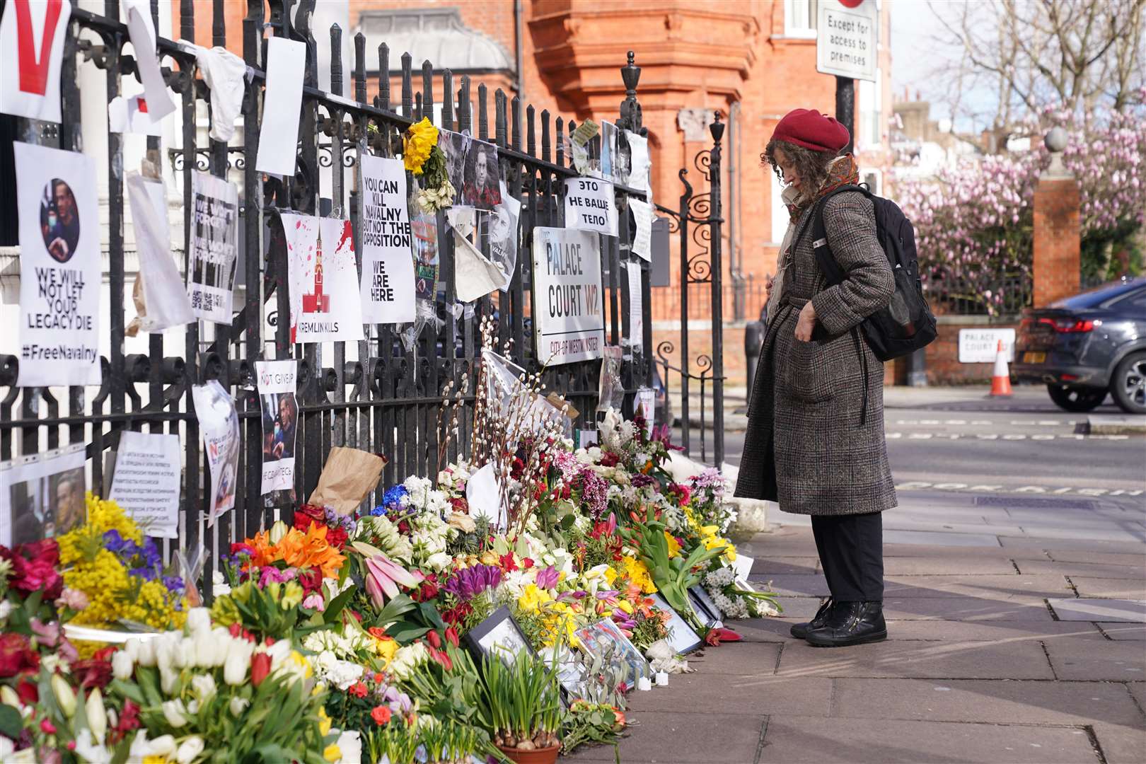 Flowers were left outside the Russian embassy in London on the day of the funeral of Vladimir Putin’s opponent Alexei Navalny (Lucy North/PA)