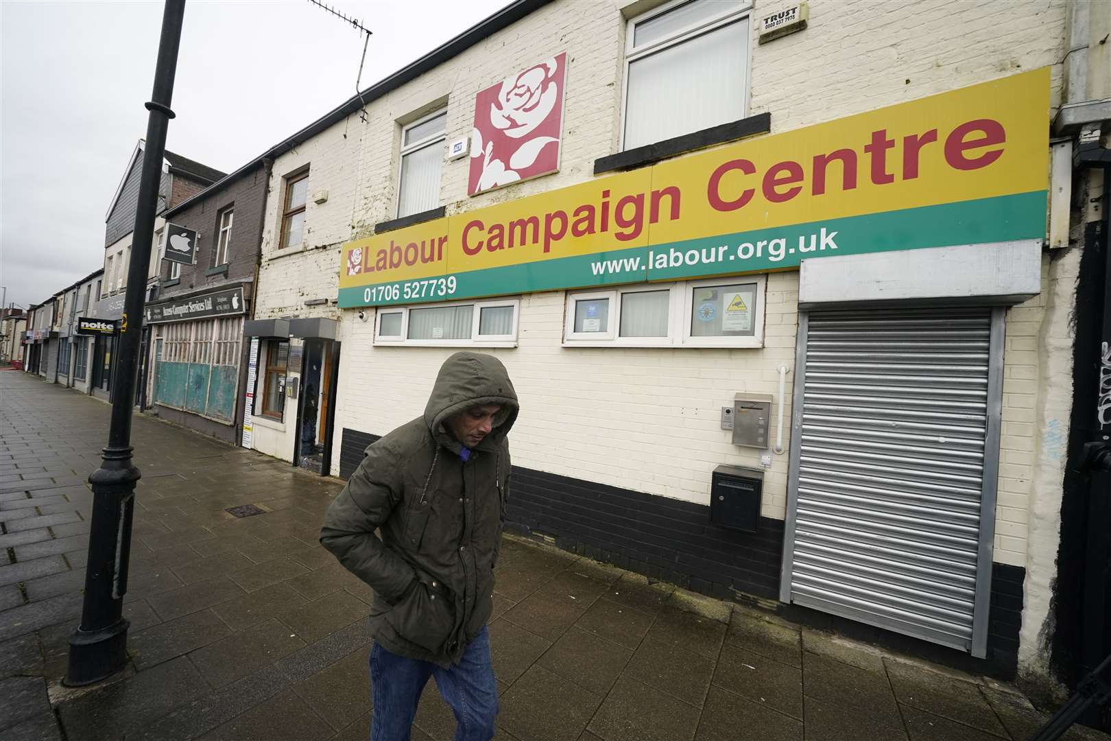 A man walks past Labour’s campaign centre in Rochdale, Greater Manchester (Danny Lawson/PA)