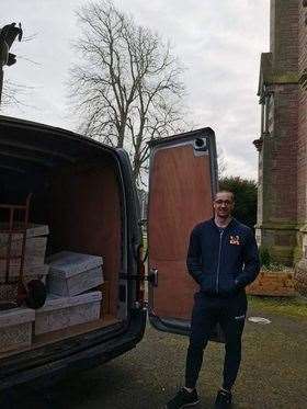 Owners of KJI's Castles and Entertainment Mariusz Roszak loading the van with the donations received.