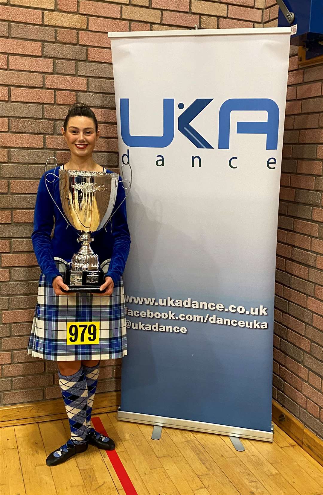 Lily with her giant UKA championships trophy won in Edinburgh this month