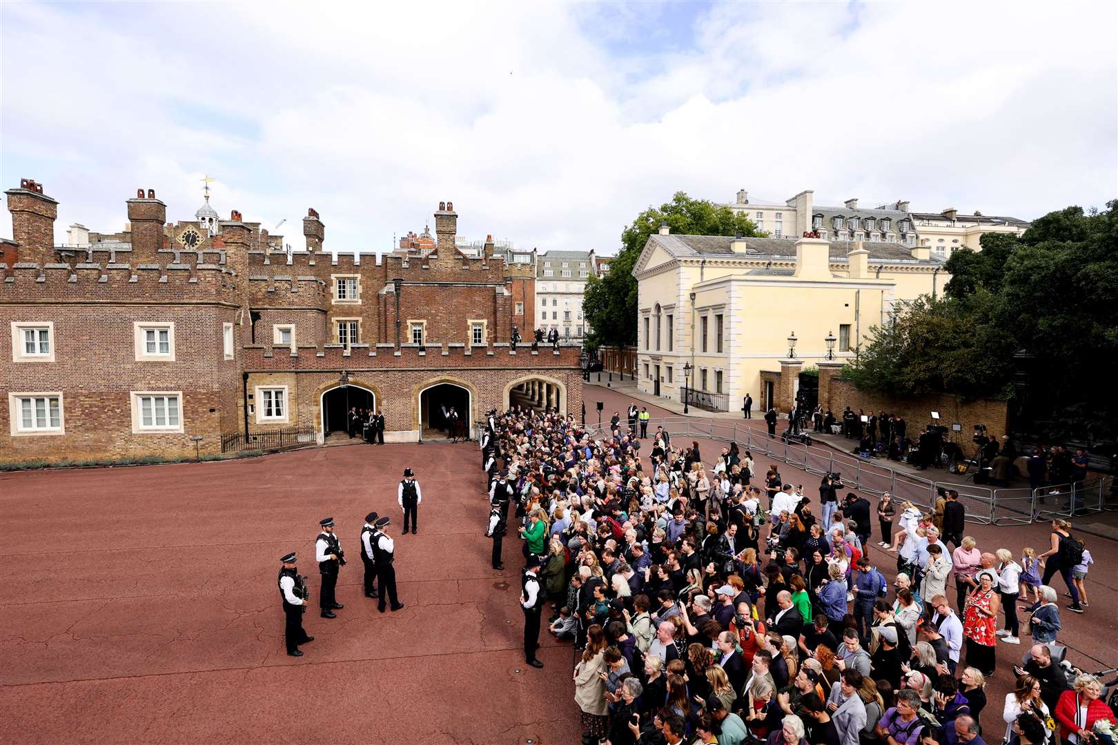 Crowds gather outside the palace to witness the proclamation (Richard Heathcote/PA)