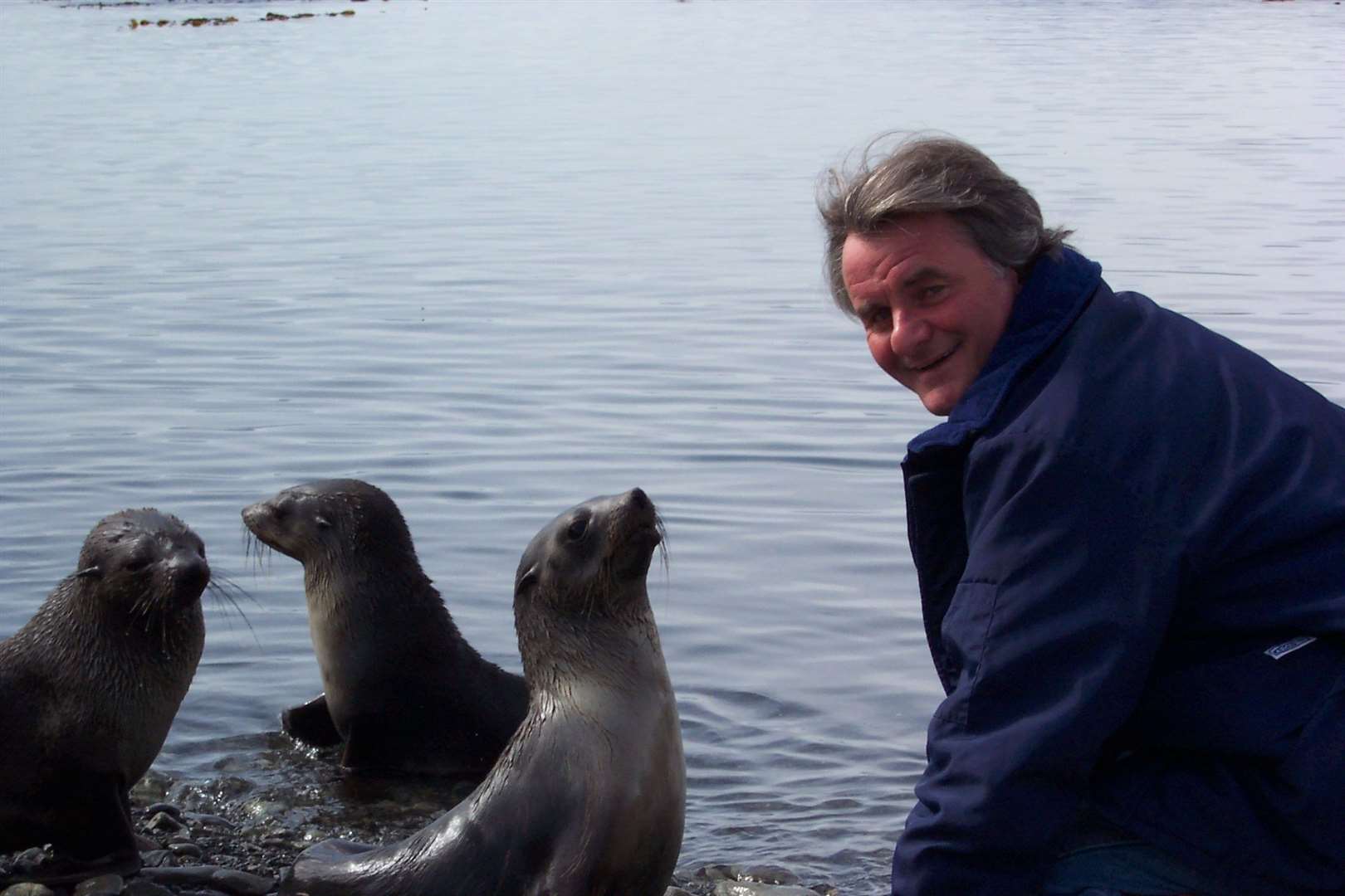 David Virgo in Antarctica, with seals