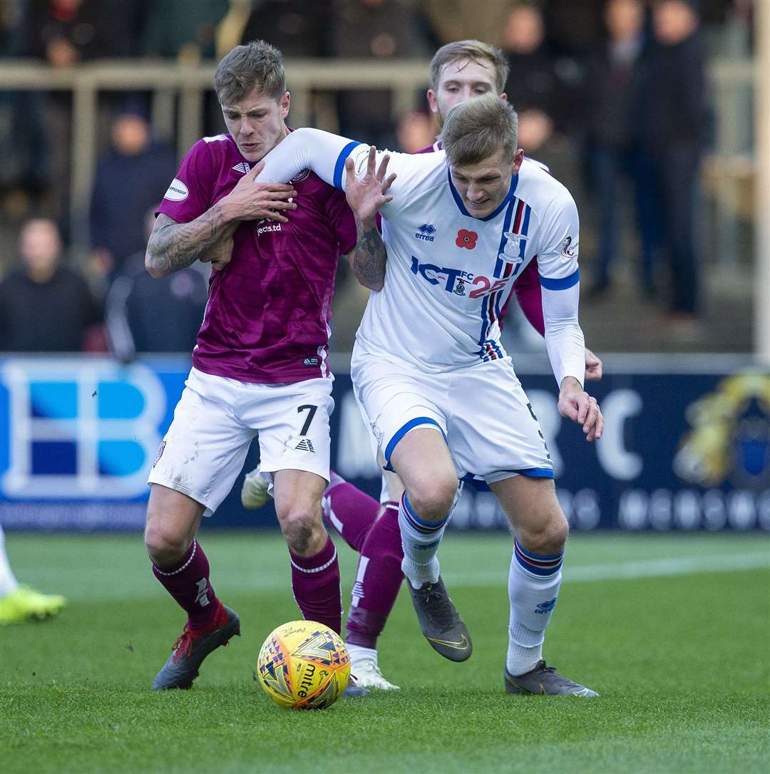Coll Donaldson in a battle for the ball with Arbroath's David Gold last weekend.