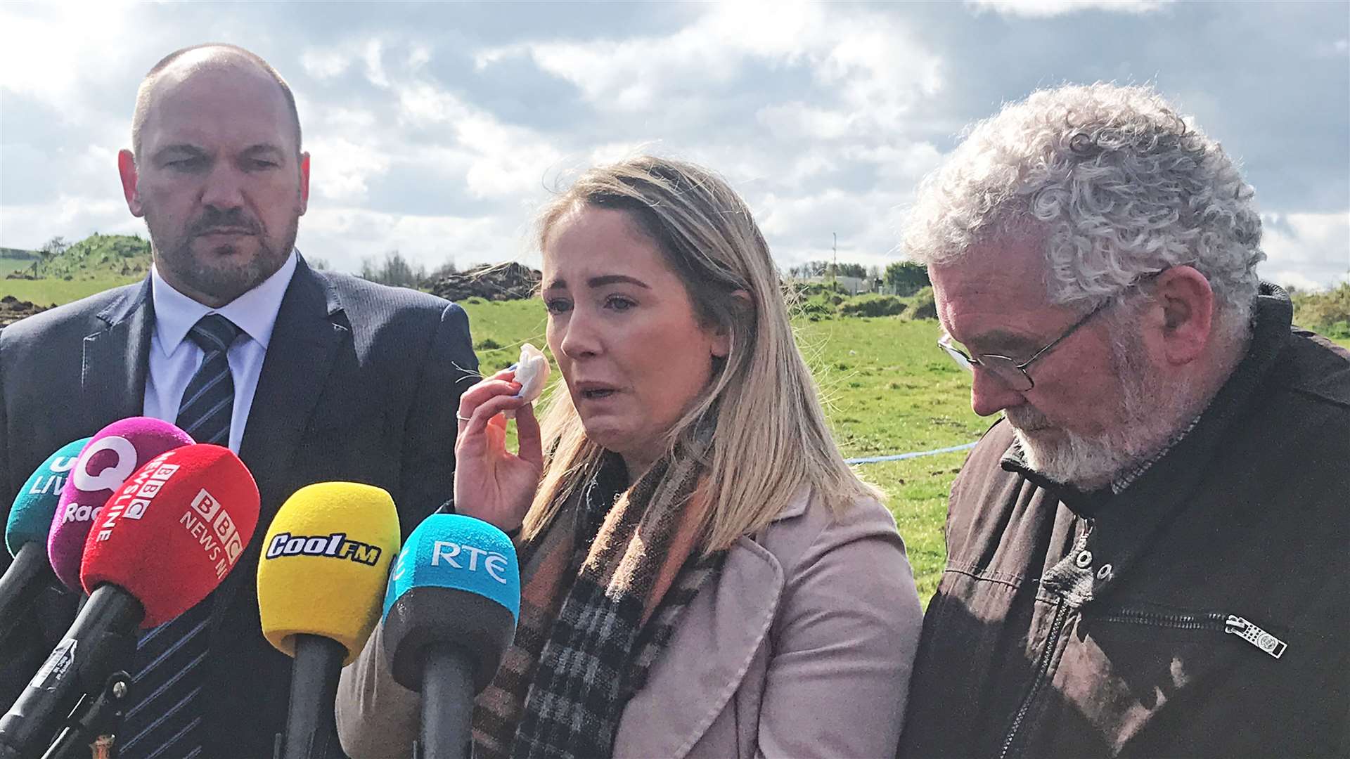 PSNI Detective Superintendent Jason Murphy, with Joanne Dorrian and her father John Dorrian at a disused airfield in Ballyhalbert, Co Down where searches for Lisa took place (Rebecca Black/PA)