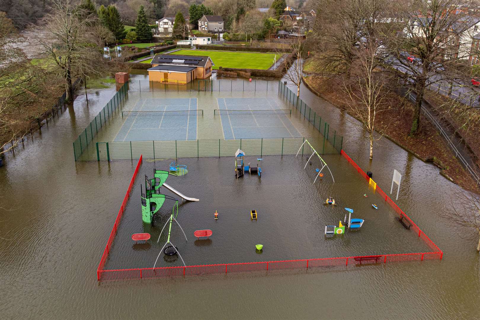 Flooding next to the River Taff has submerged the play park in Taff’s Well, Wales (Ben Birchall/PA)