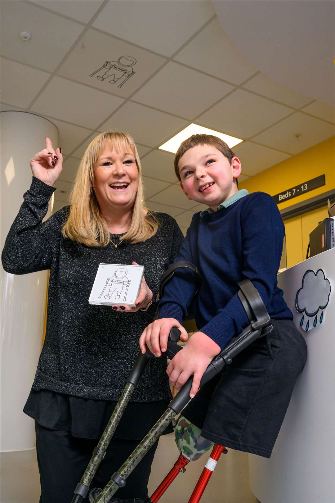 Tony Hudgell, pictured with his mother Paula, has been depicted on a ceiling tile in a new unit at Evelina London Children’s Hospital (David Tett/Guy’s and St Thomas’ NHS Foundation Trust/PA)