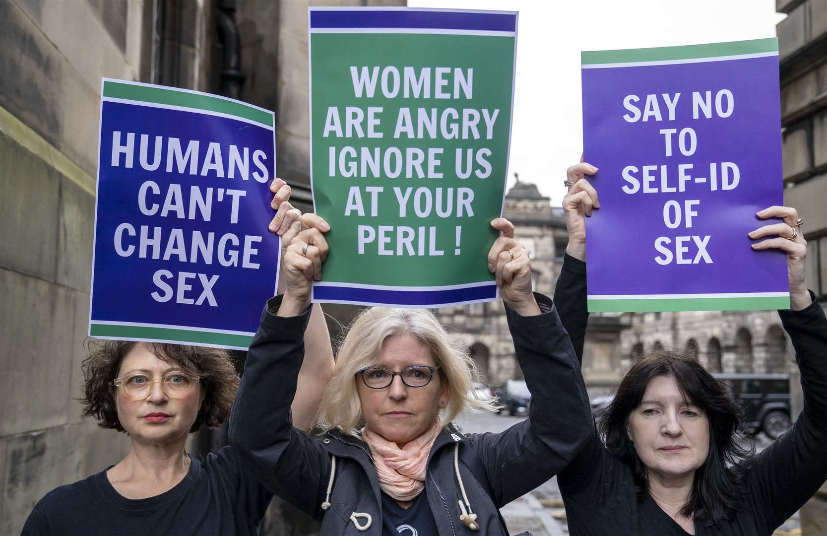 Members of the Scottish Feminist Network protested outside the Court of Session (Jane Barlow/PA)