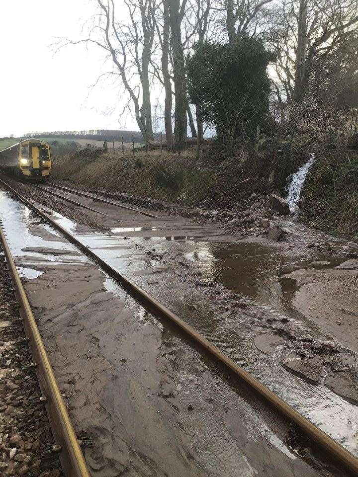 A flood and land slippage near Dybe on the Inverness to Aberdeen line today