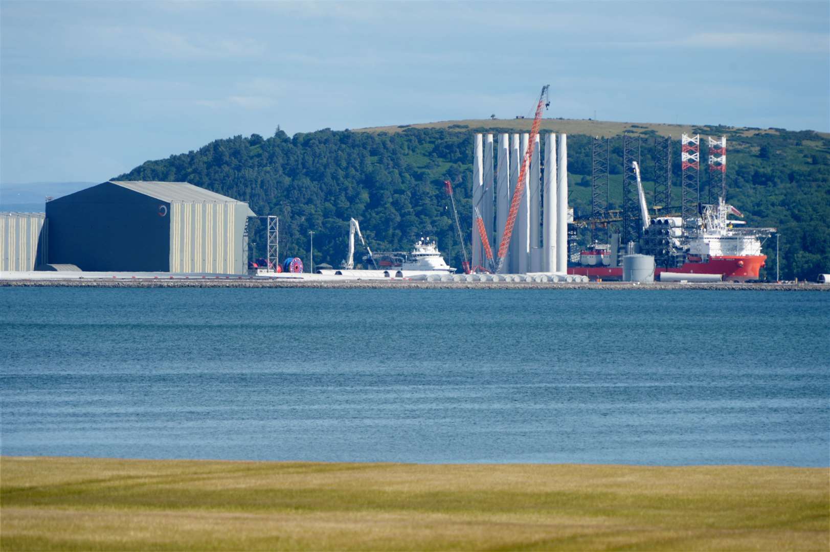 Giant wind turbines for the Beatrice offshore wind farms being unloaded at Nigg Energy Park.