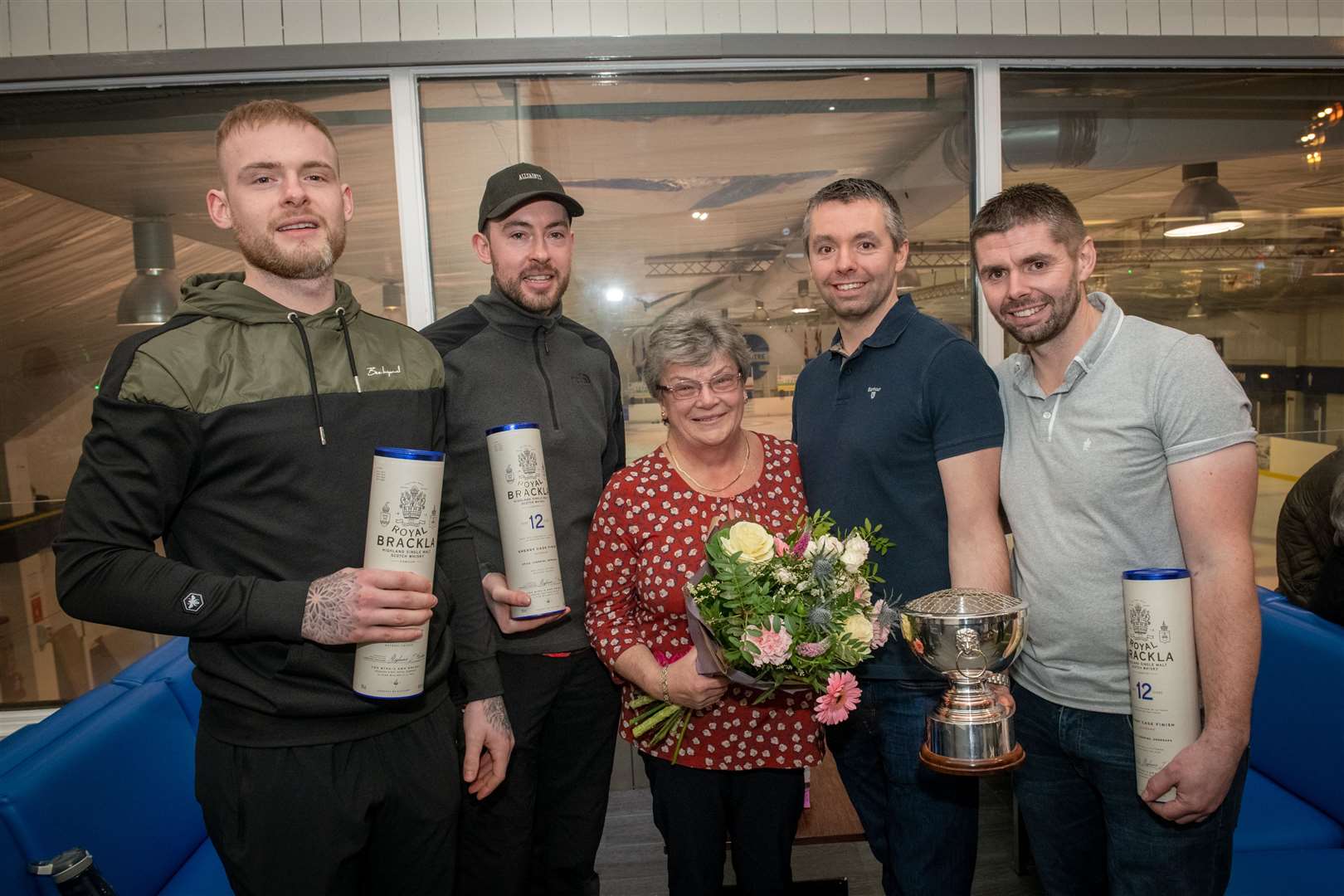 Calum Greenwood, Ruairidh Greenwood, Ally Fraser (skip) and Grant Fraser pictured with Joan Macarthur after winning the tournament. Picture: Callum Mackay