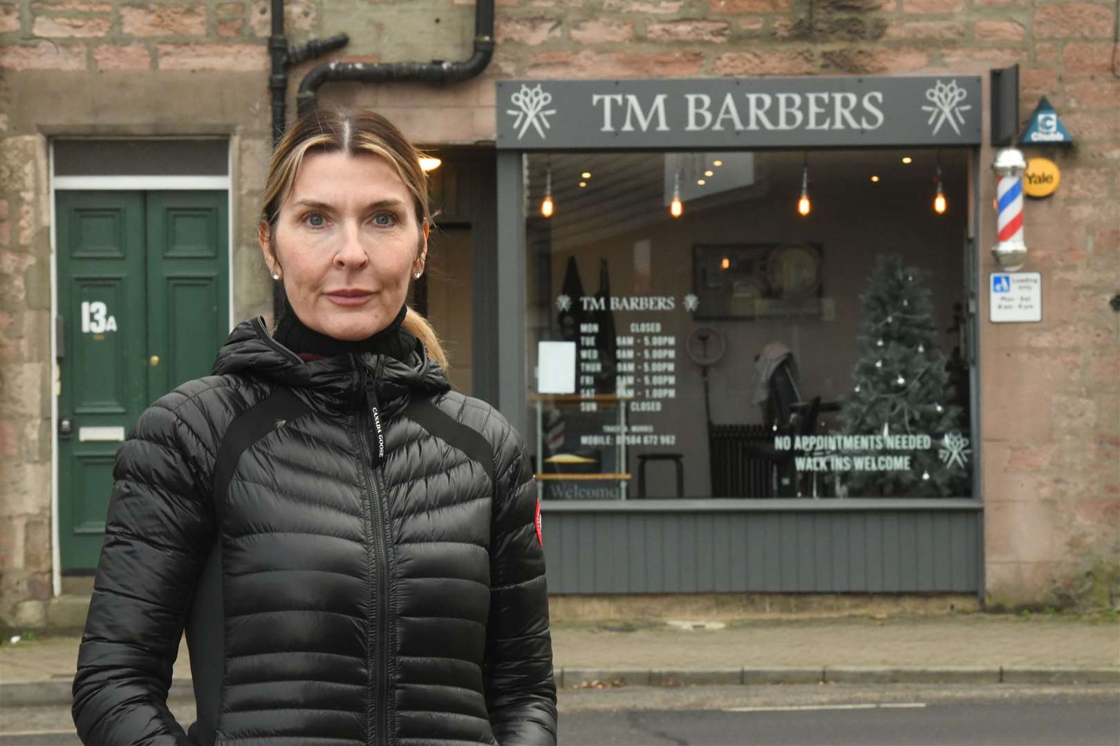 Tracey Morris, owner, outside TM Barbers. Picture: James Mackenzie.