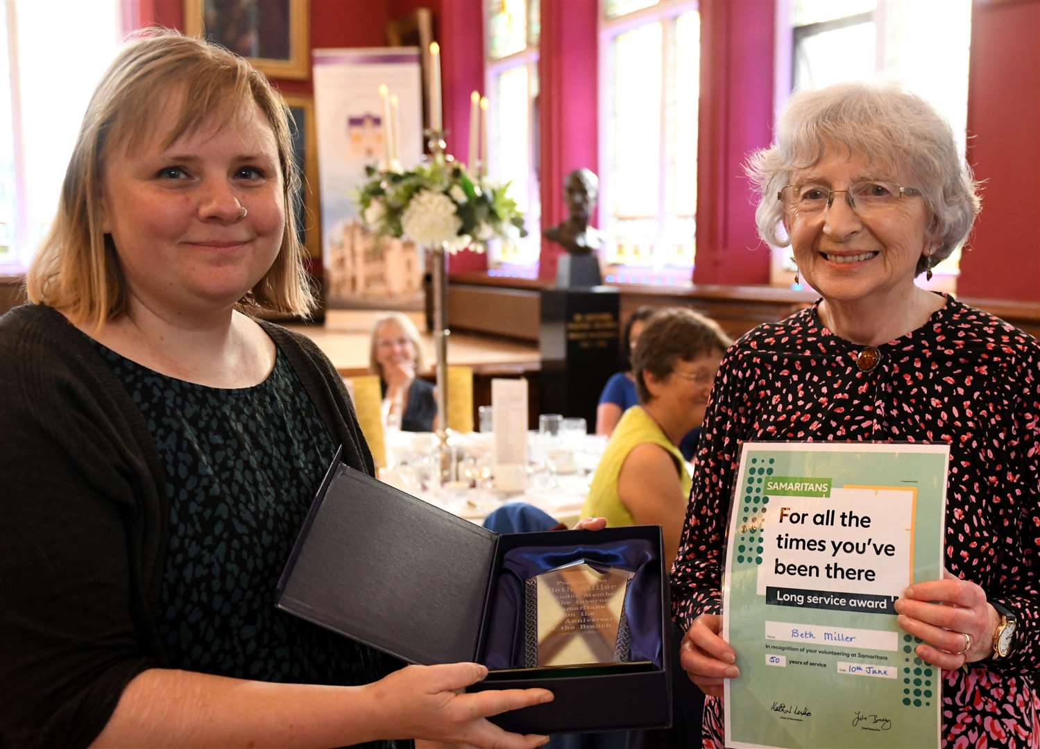 Rachael Thomas presenting a Long Service Award to Beth Miller. Picture: James Mackenzie.