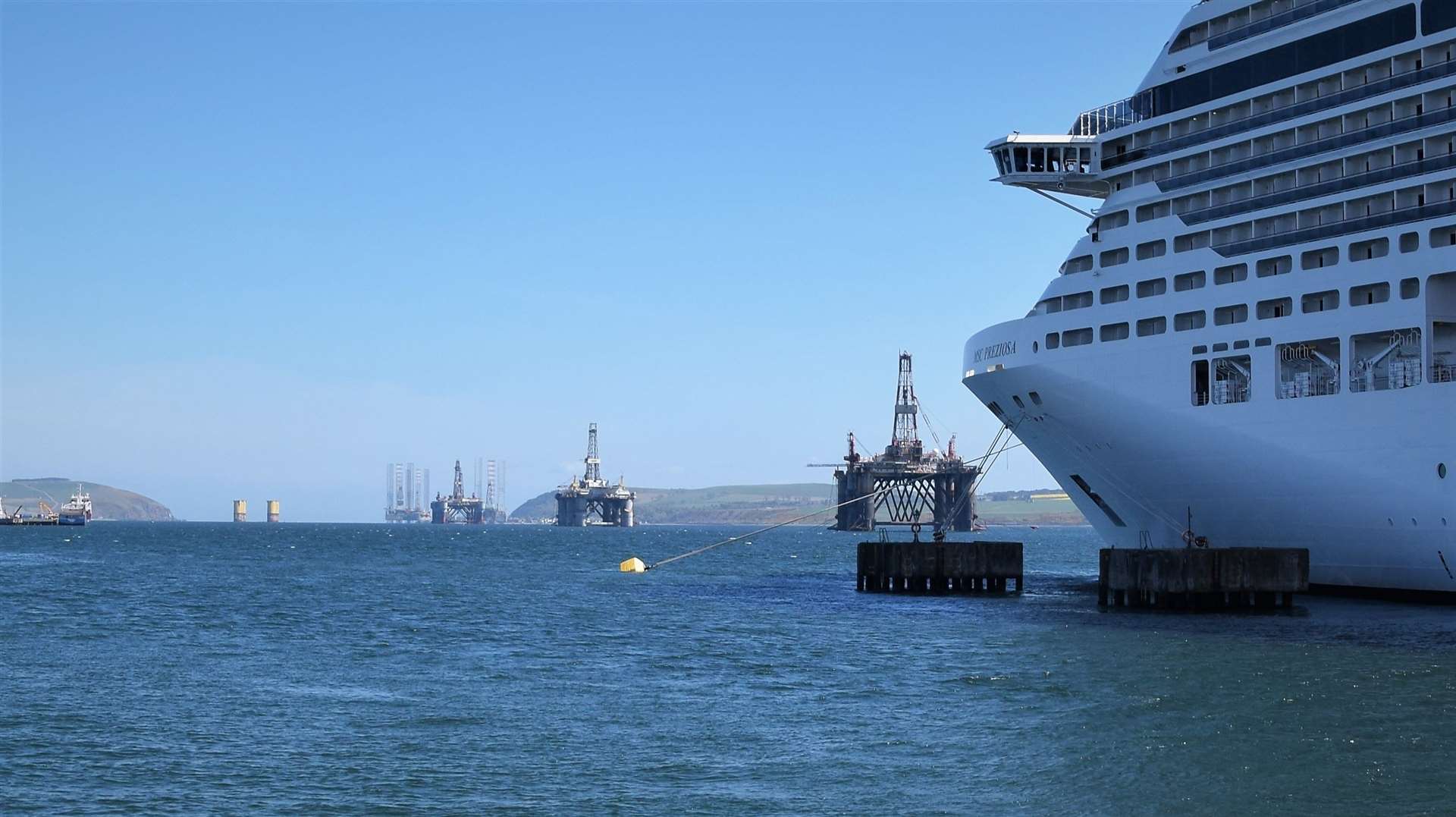The MSC Preziosa at Invergordon looking east towards rigs in the Cromarty Firth and the Sutors during a previous visit.