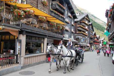 Horse drawn carriage in quaint Zermatt.