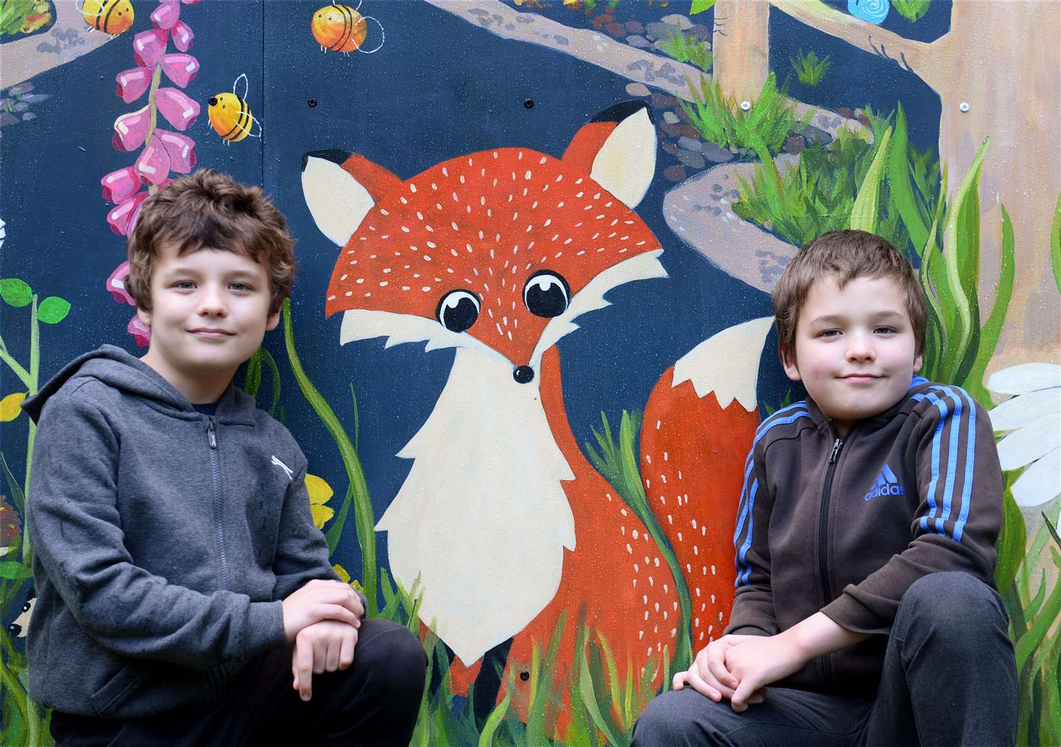Jamie and Craig Borthwick find their favourite character in the mural. Picture: Gary Anthony