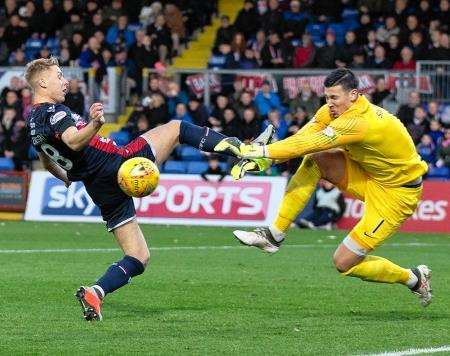 Ross County's Jamie Lindsay loses out to Dundee United goalkeeper Benjamin Siegrist last Saturday. Picture: Ken Macpherson