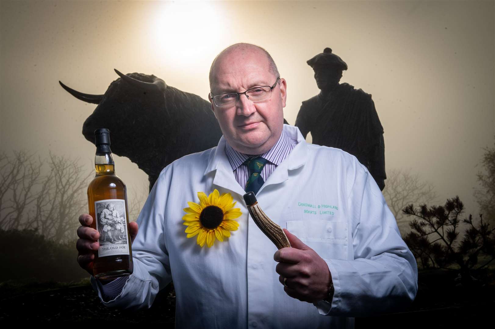 Grant Macpherson, managing director of Dingwall and Highland Auction Mart with a rare bottle of Old Fox Whisky. Picture: Callum Mackay