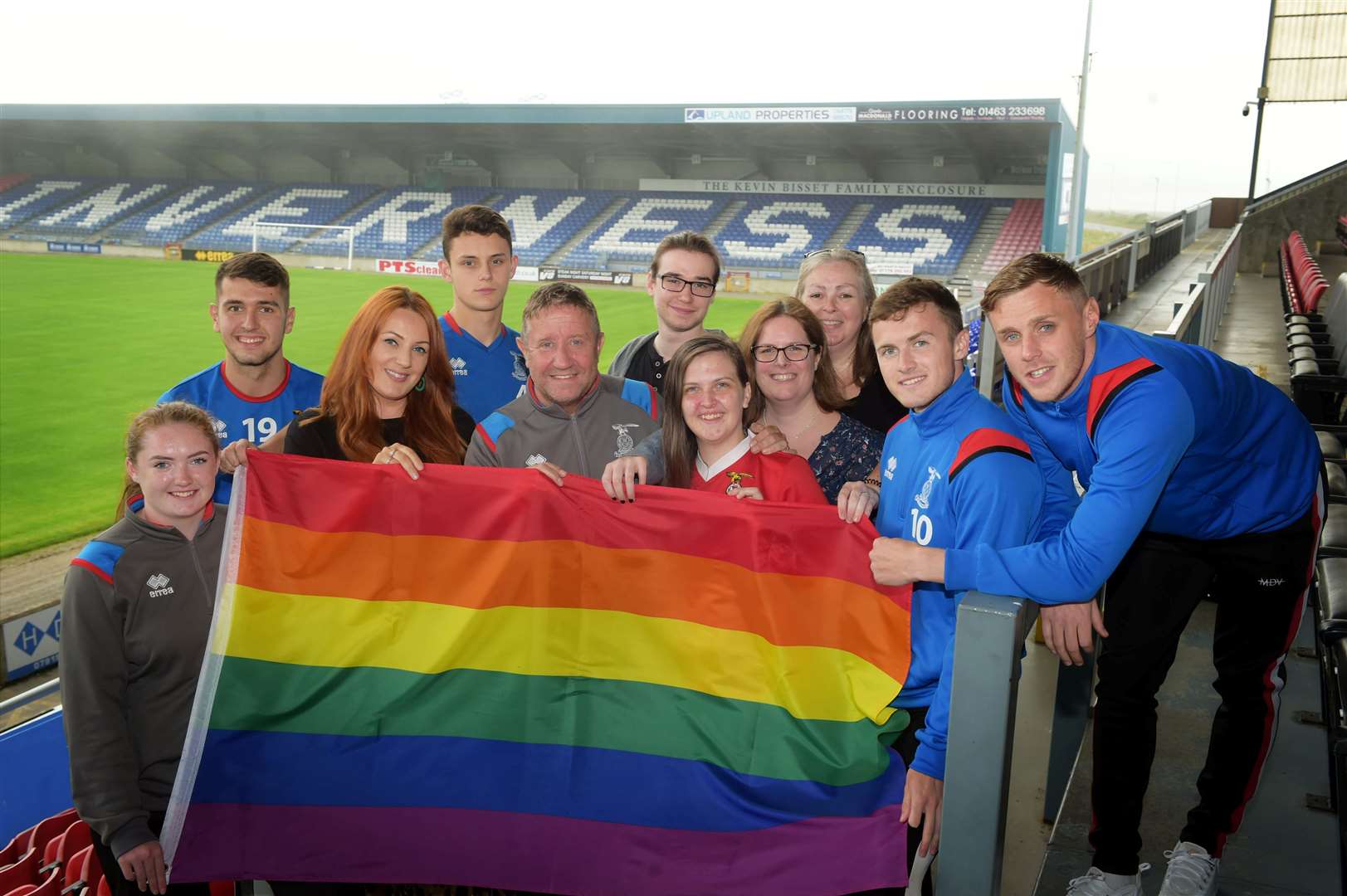 Members of the then-ProudNess committee and Caley Thistle squad with the rainbow flag in 2019. Picture: Callum Mackay