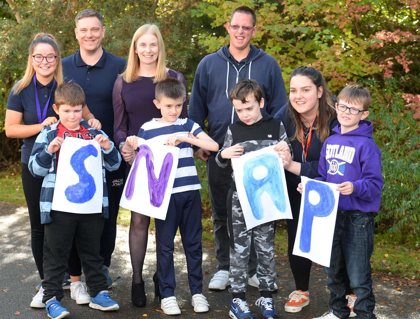 Snap service users (front, from left) Kieran MacPherson, Rory O'Brien, Logan Marshall and Rhys Ritchie-MacKenzie, with staff Emily Twaddle, Andrew Greig, fundraising mum Claire O'Brien, Dean Stewart and Katie Kay.