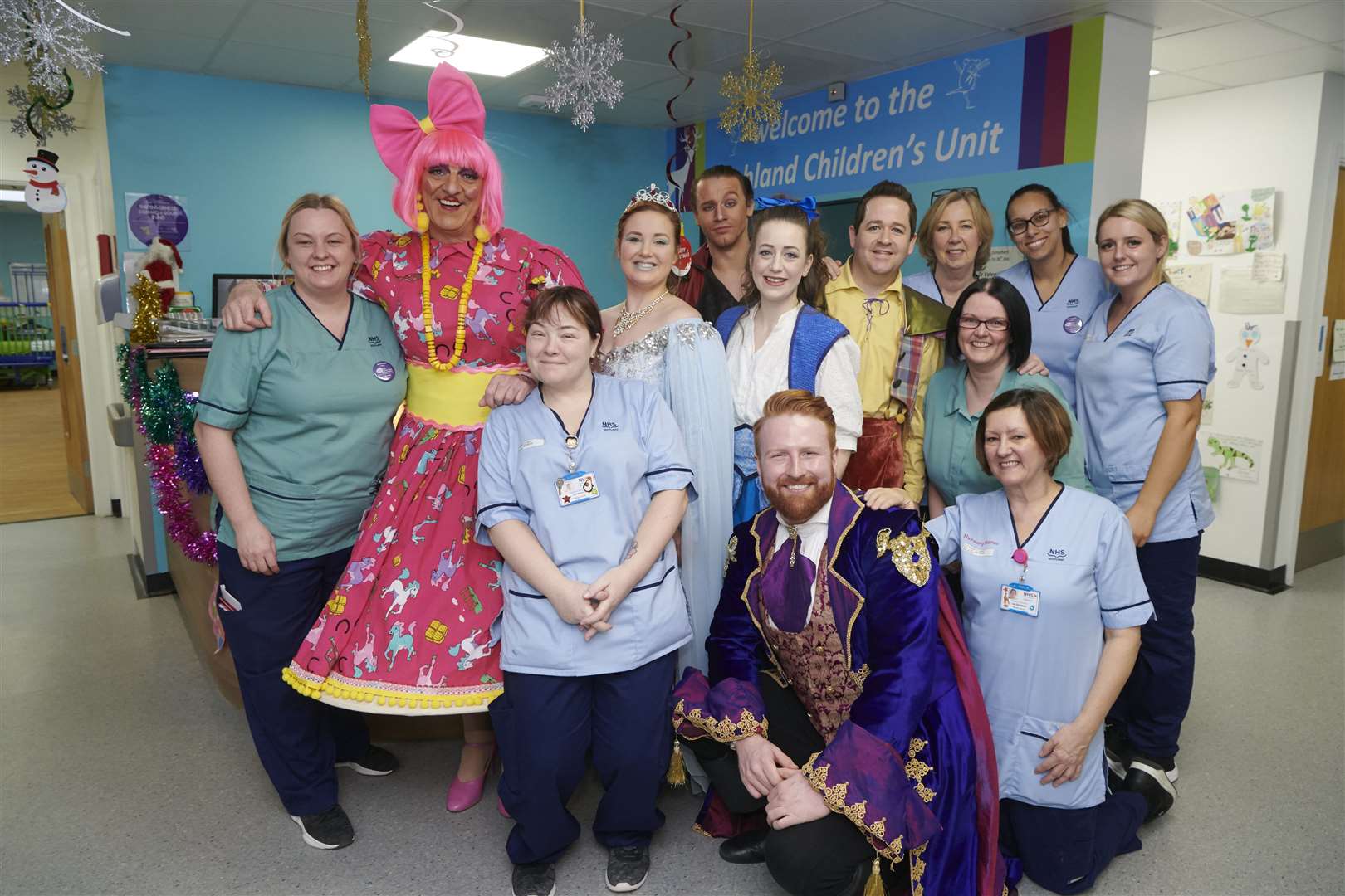 Posing for a happy pic – nurses, staff and panto stars are all smiles.
