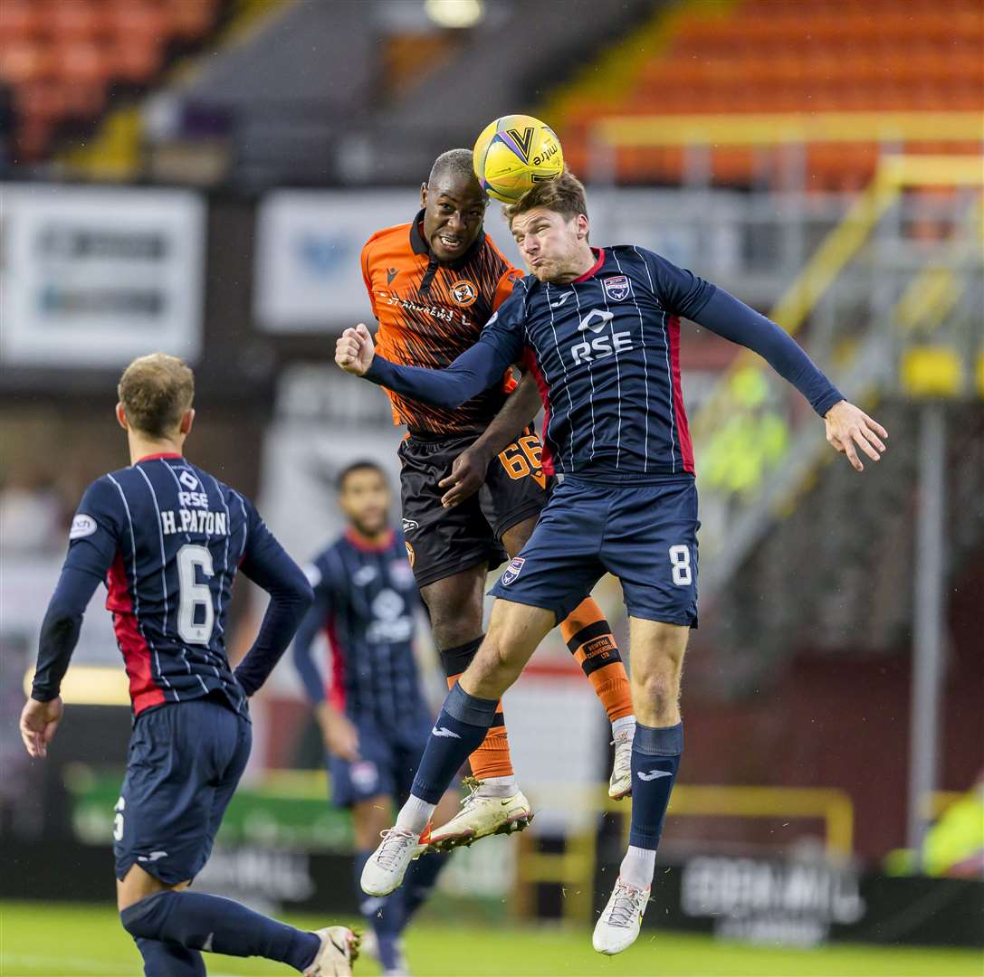 Jeando Fuchs challenges County's Scott Callachan in the Tannadice match. Picture - Kenny Ramsay.