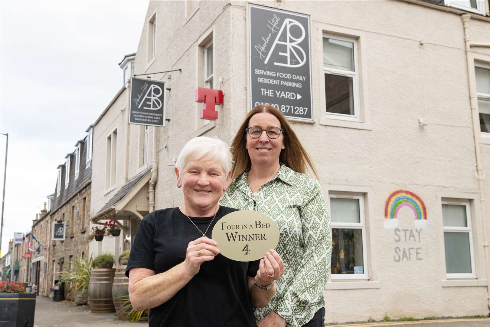 Alison Taylor (left) and Kellie Spooner with their Four in a Bed winners plaque. Picture: Beth Taylor