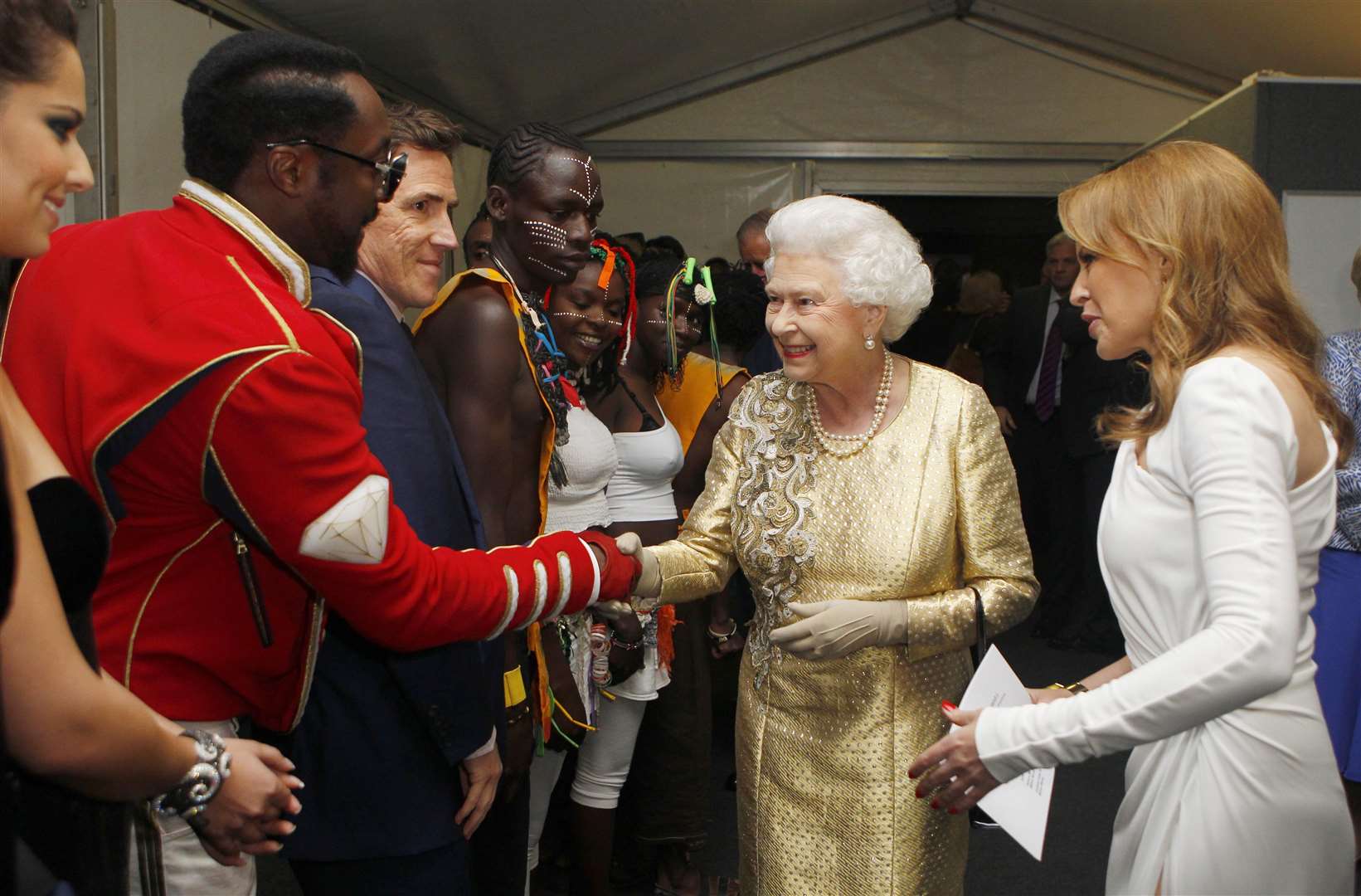 The Queen, with Kylie Minogue, meets will.i.am backstage at the Diamond Jubilee Concert at Buckingham Palace in 2012 (Dave Thompson/PA)