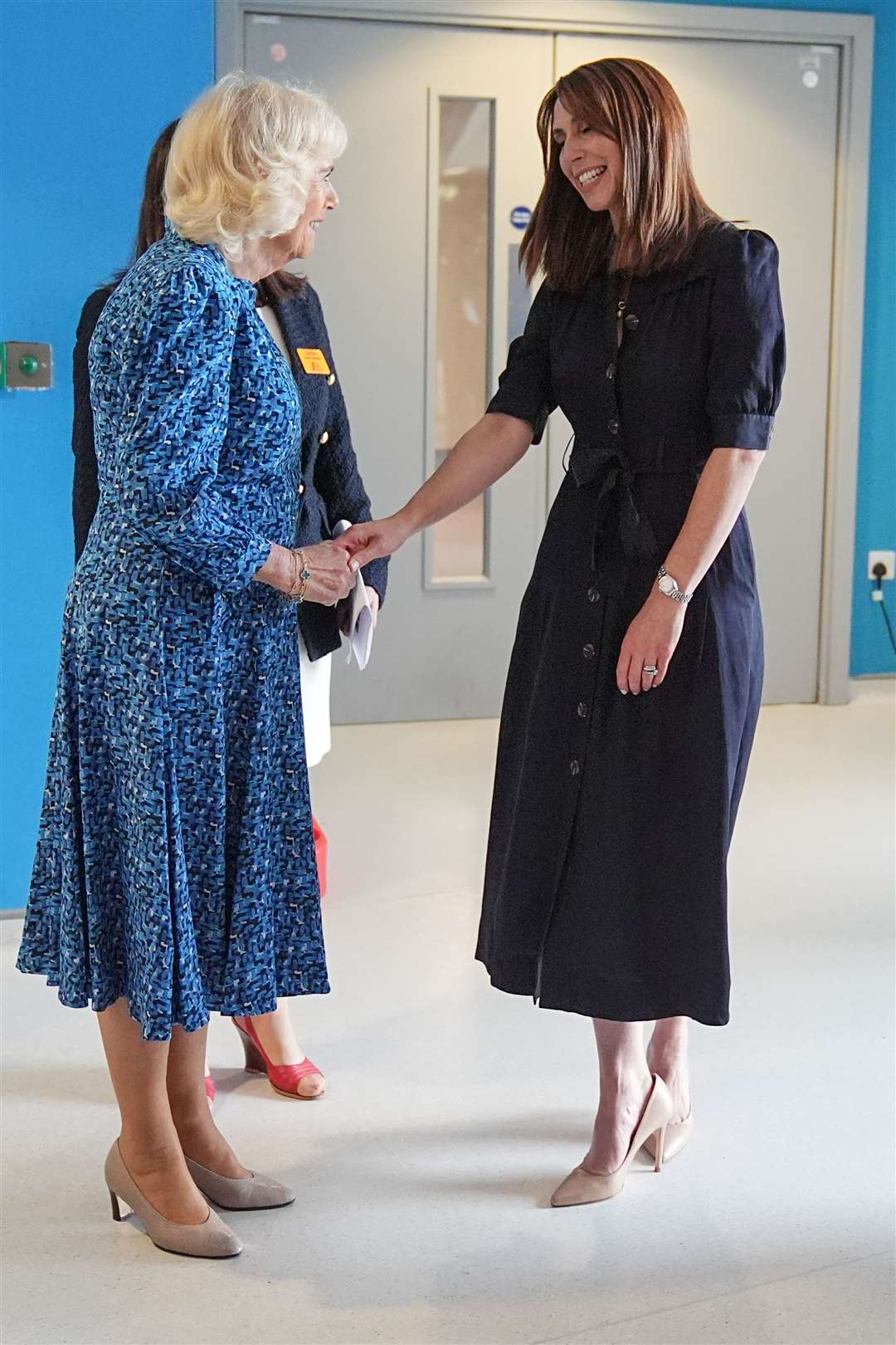 Camilla shakes hands with TV presenter Alex Jones (Aaron Chown/PA)