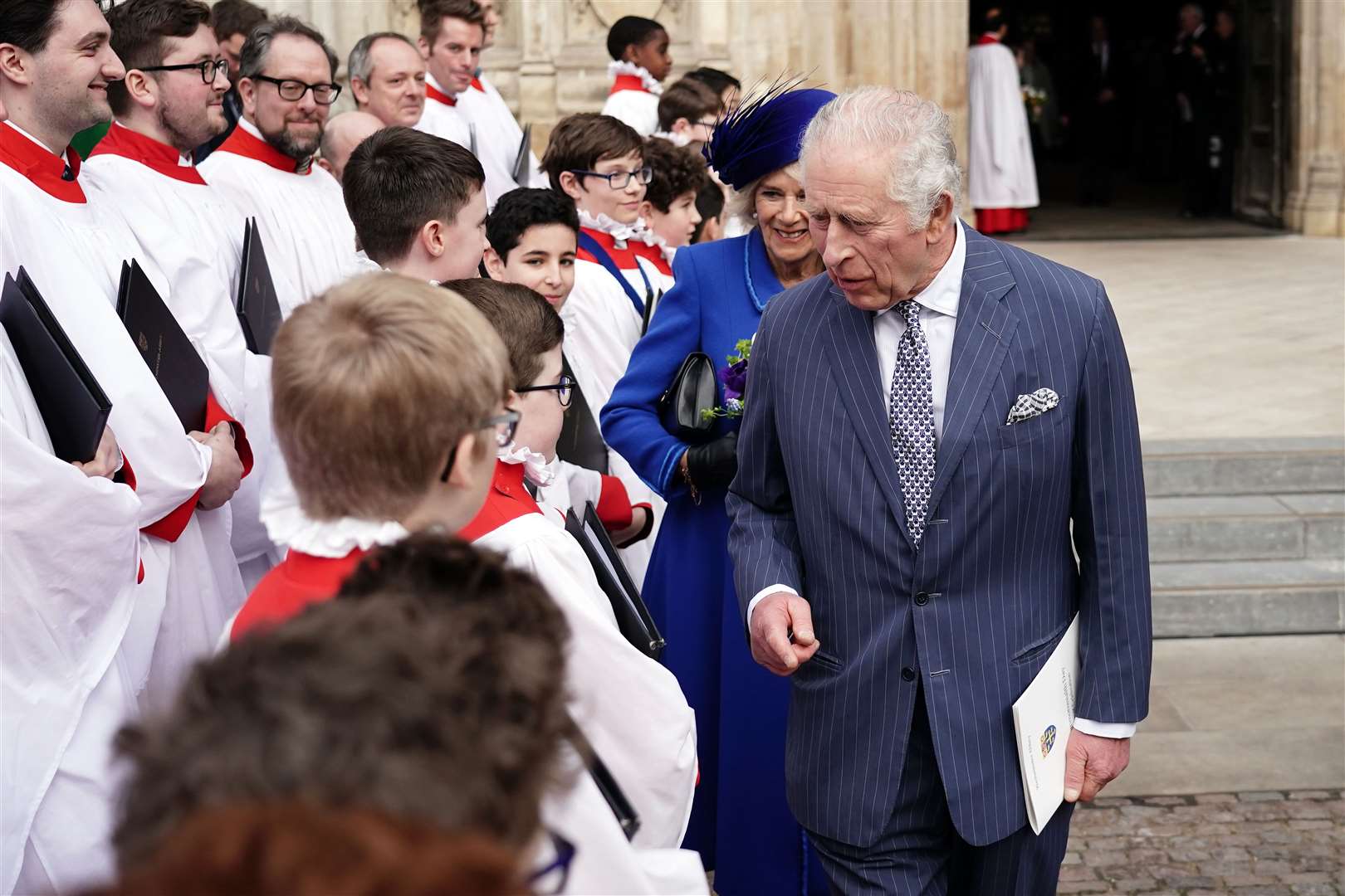 Charles meeting choristers at last year’s Commonwealth Day Service at Westminster Abbey (Jordan Pettitt/PA)