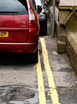 A car spotted on double yellow lines outside the school.
