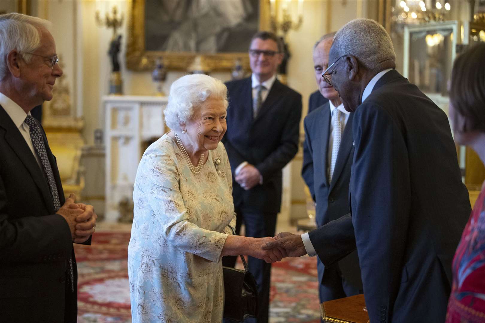The Queen with Sir Trevor McDonald, a trustee of The Queen’s Trust (Victoria Jones/PA)