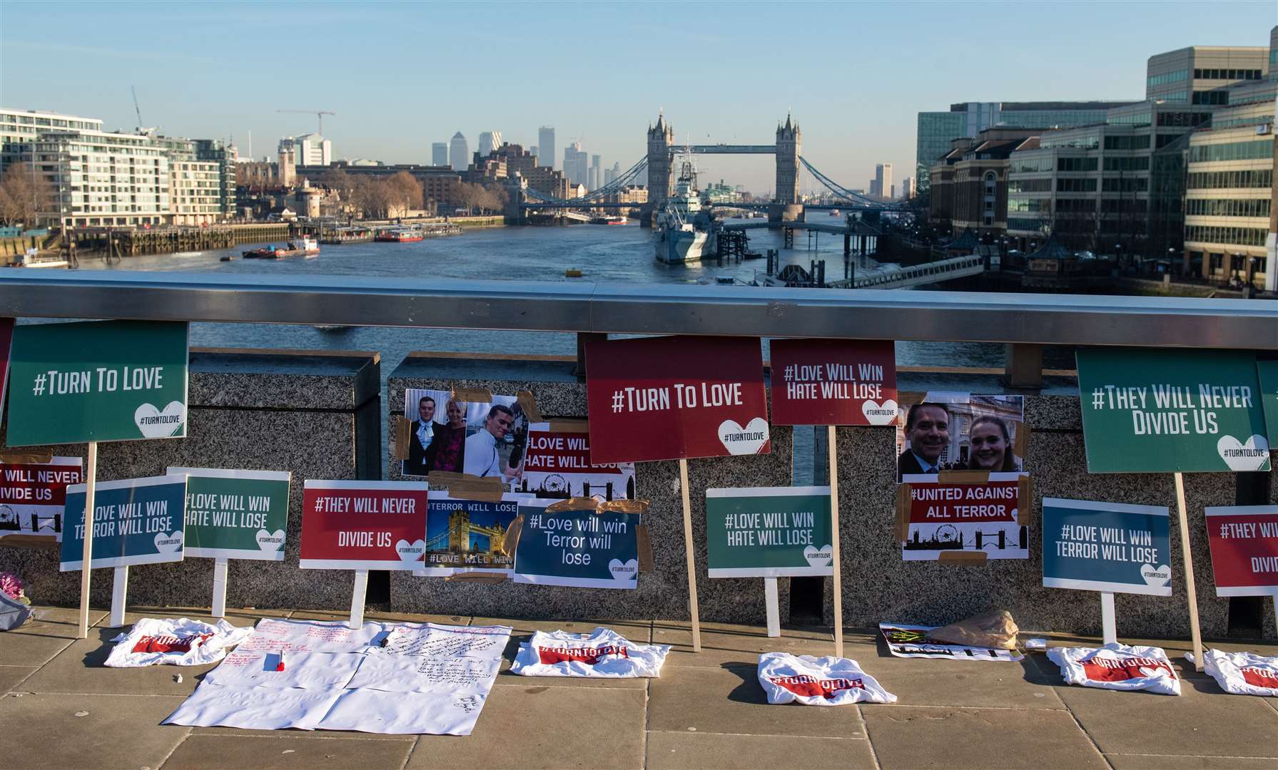 Placards and photos on London Bridge for the victims of the terrorist attack (Dominic Lipinski/PA)