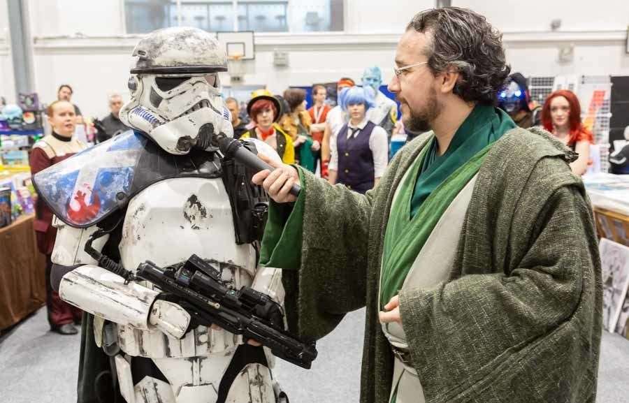 A Star Wars stormtrooper tackles "rebel scum" at a previous Comic Con event