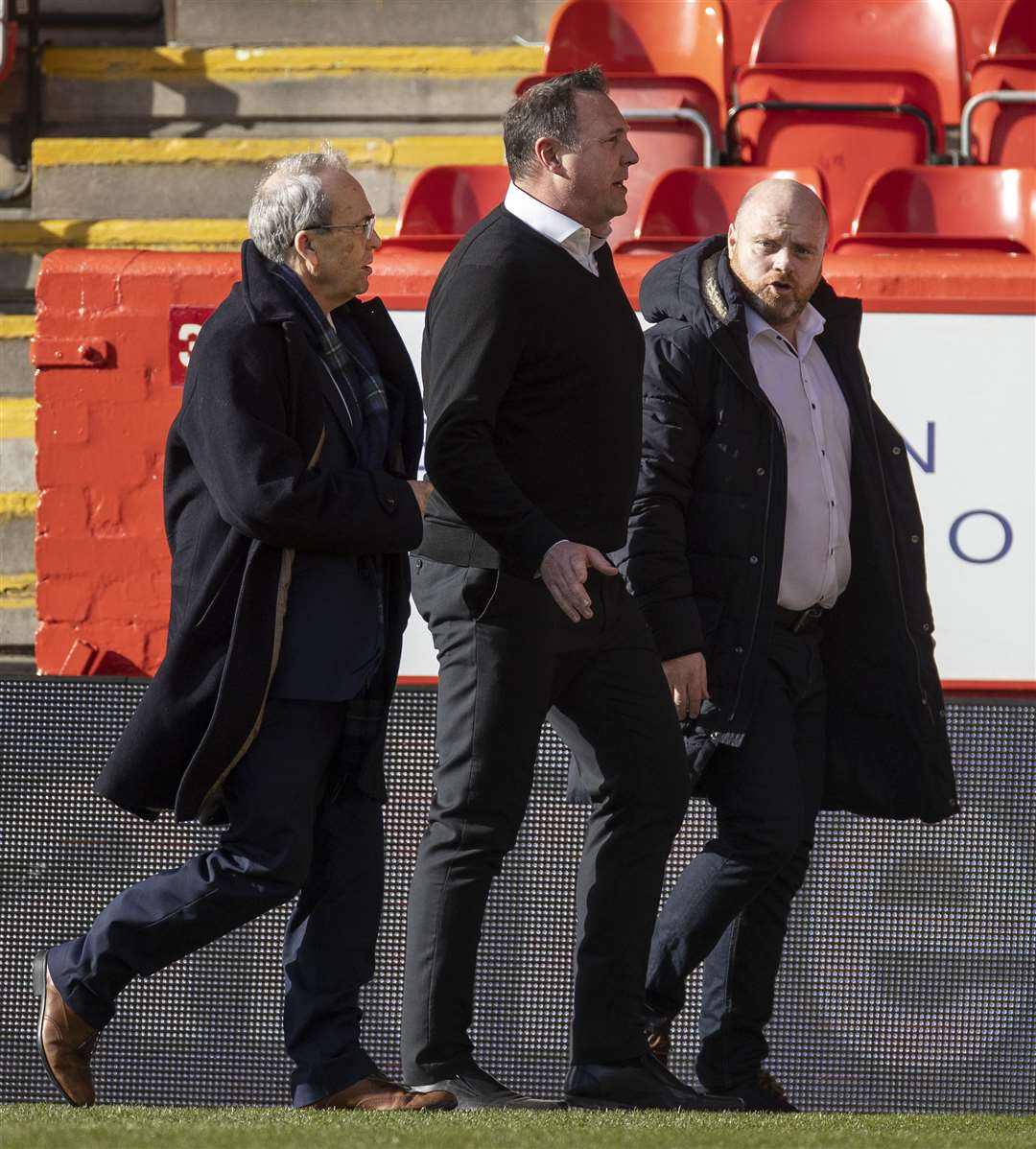 Ross County chairman Roy MacGregor and CEO Steven Ferguson with manager Malky Mackay at the end.