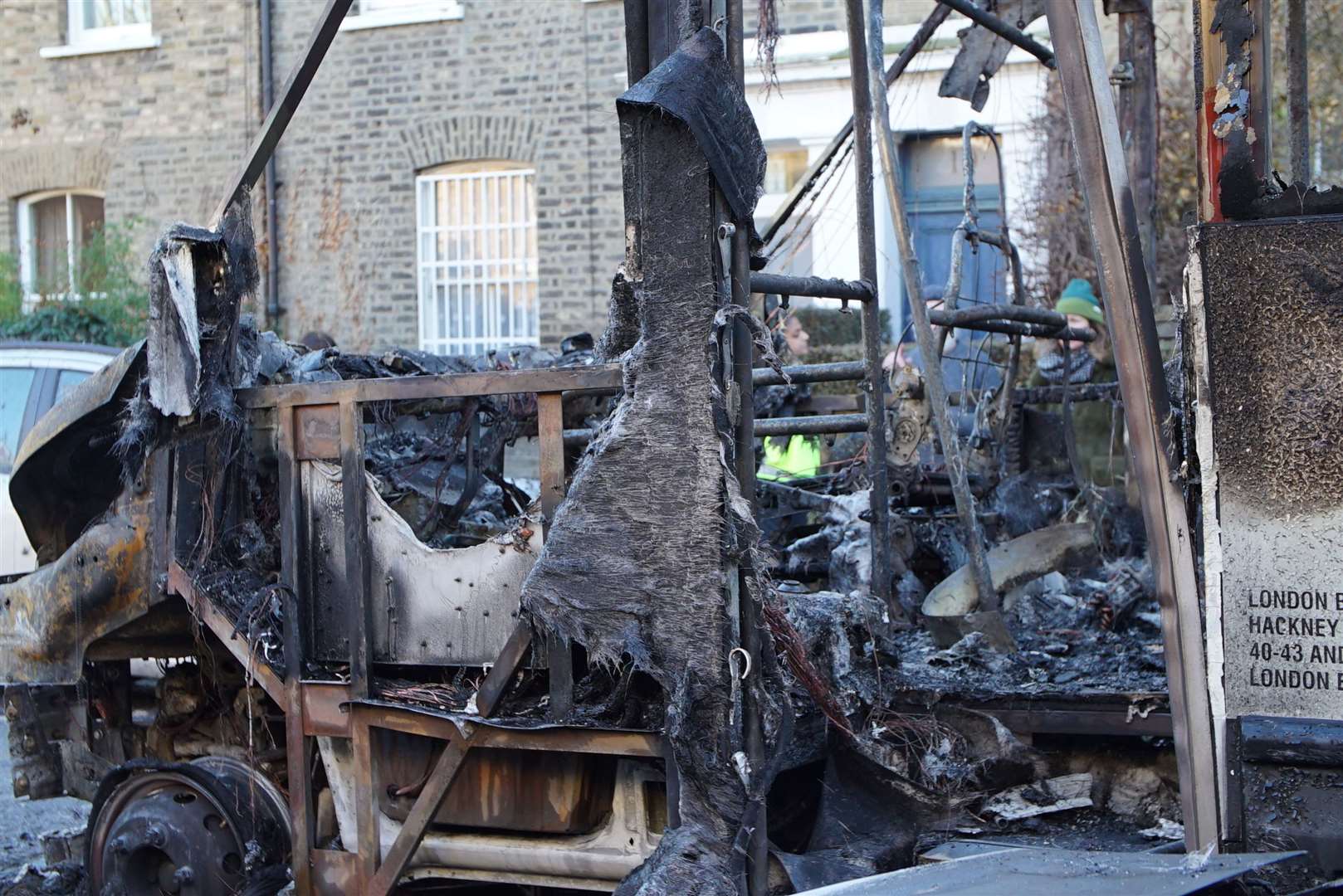 A 30-seater bus, six other vehicles and surrounding properties were damaged in the fire on Wilton Way in Hackney (Eleanor Cunningham/PA) 
