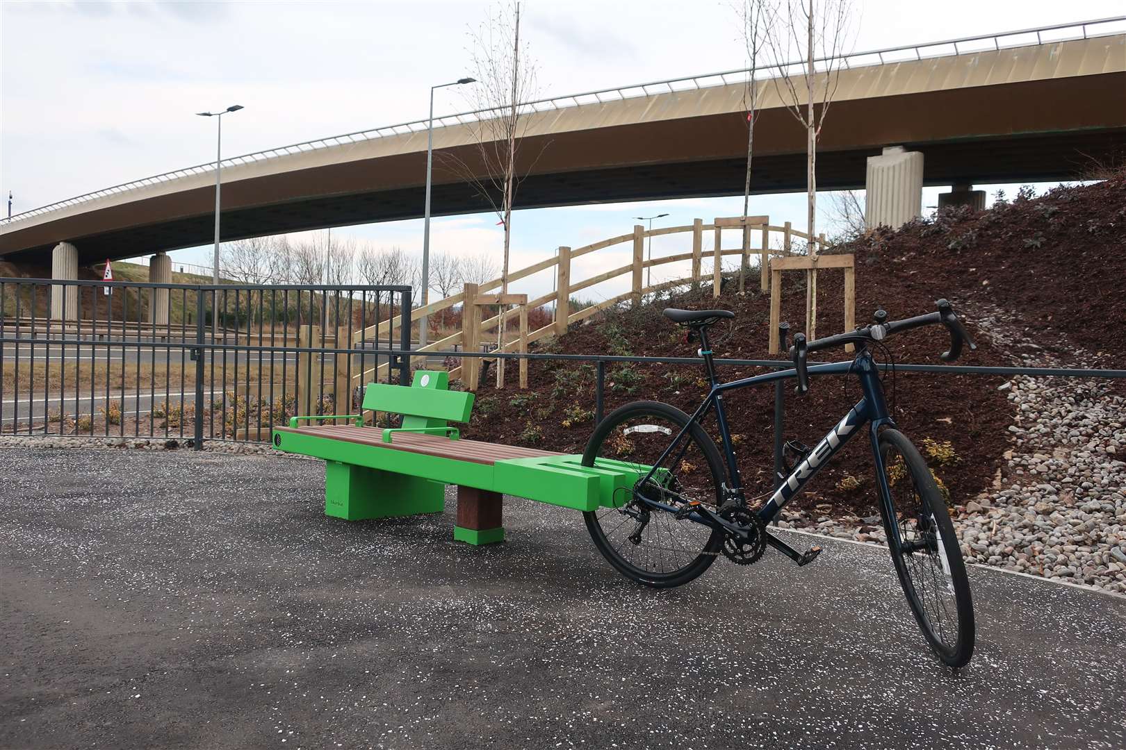 This bench below the Golden Bridge features a bike wheel rest.