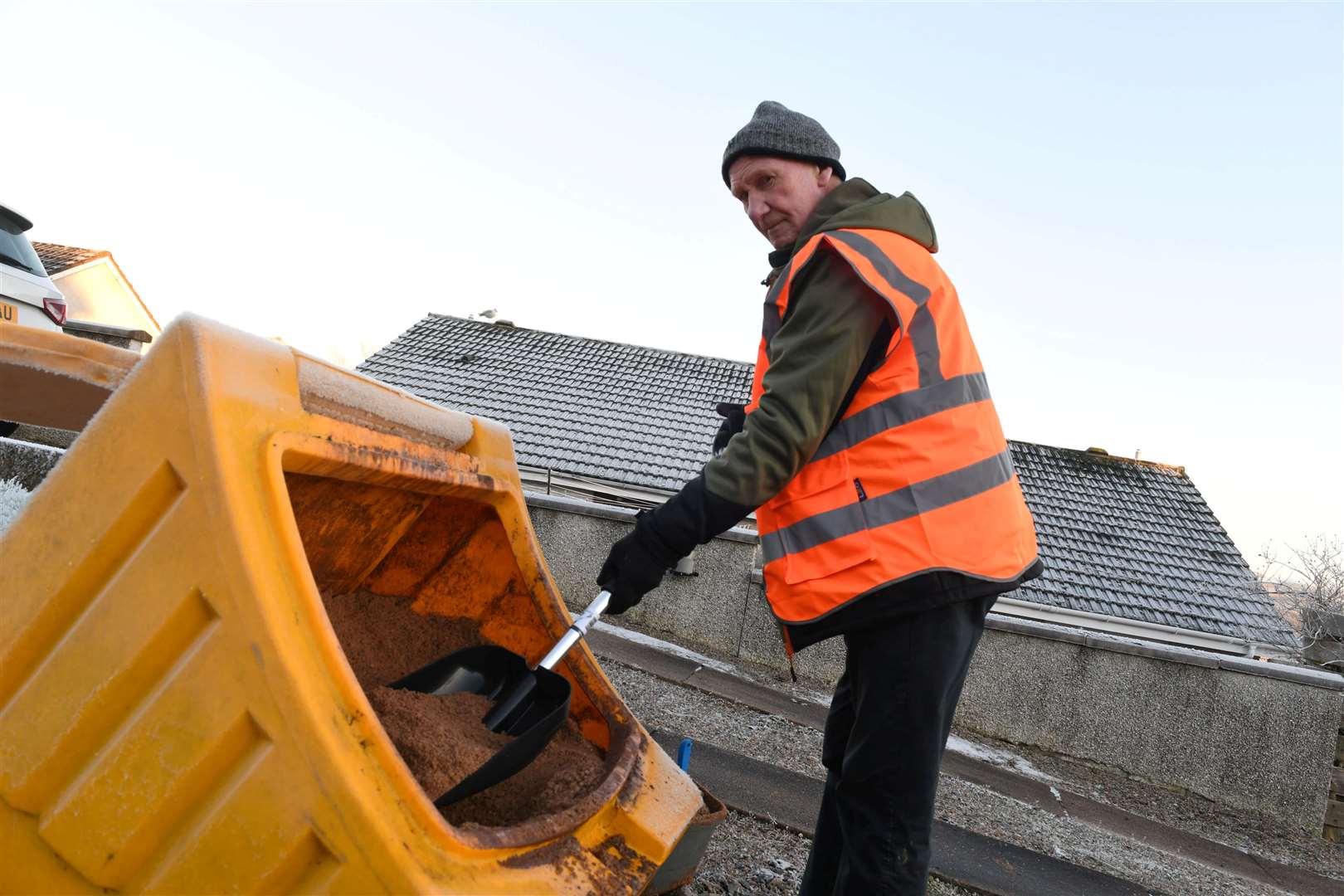 Bill Anderson has been among the city residents helping his neighbours by gritting in the area where he lives. Picture: Callum Mackay